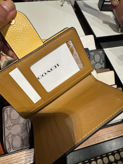 Medium Corner Zip Wallet In Signature Canvas